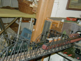 Two trains pass on the bridge.