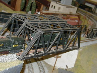 The freight crosses another bridge.