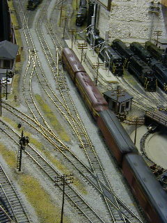 A pair of E units pulls a late running passenger train west.